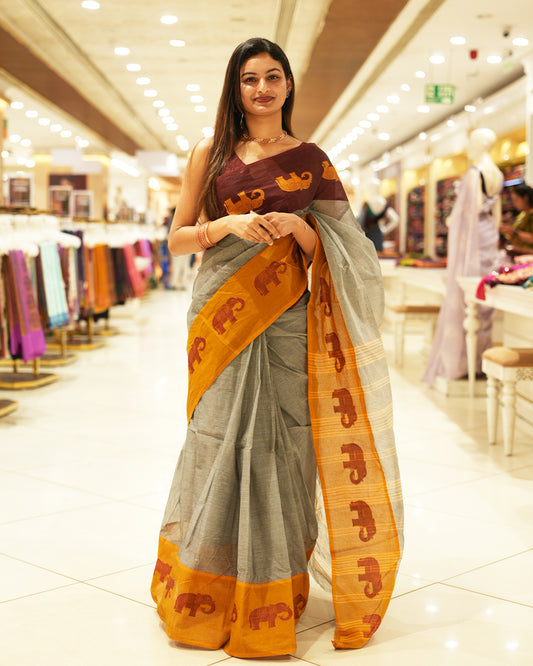 Mustard With Maroon Bengal cotton saree featuring Ganga Jamuna Style Contrast Border with elephant motifs, Striped pallu.