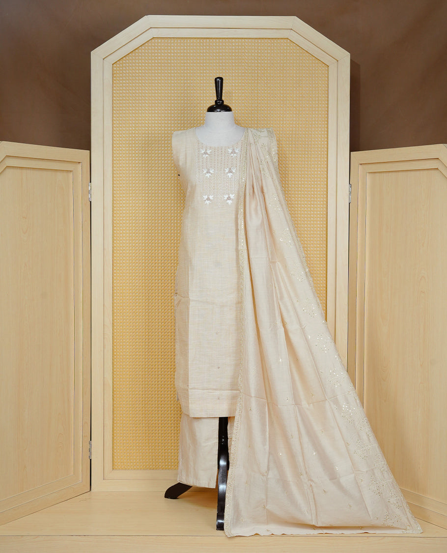 Beige colour churidar set featuring delicate floral embroidery on the yoke, paired with matching solid pants and an embroidered dupatta