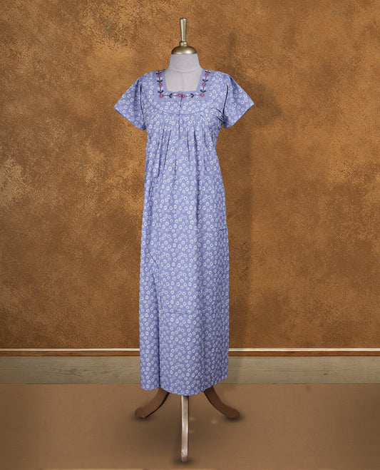 Light lavender colour NStyle nighty featuring White floral patterns, a Square neckline and thread pattern, short sleeves, and a full ankle-length design.