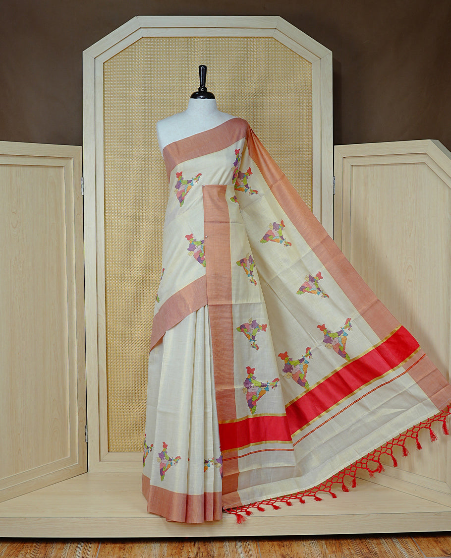 Cream Colour Kerala Saree Featuring Plain Body ,Complemented By A Red  Zari With Indian Map Border ,Enhance By A Gold Zari & Red  Pallu ,Paired With A Matching Blouse Piece.