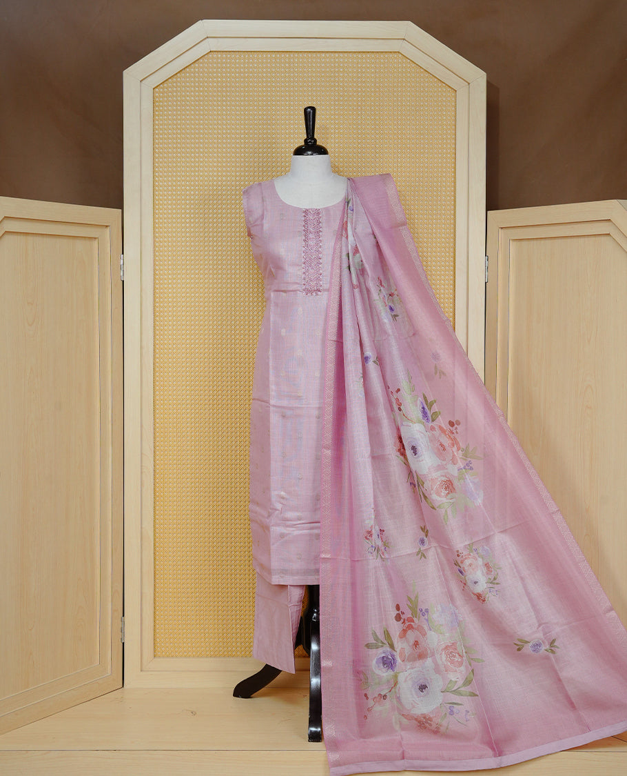 Dusty rose colour churidar set with delicate thread embroidery on the round neckline, featuring subtle woven buti detailing, paired with a matching floral printed woven dupatta and solid pants.