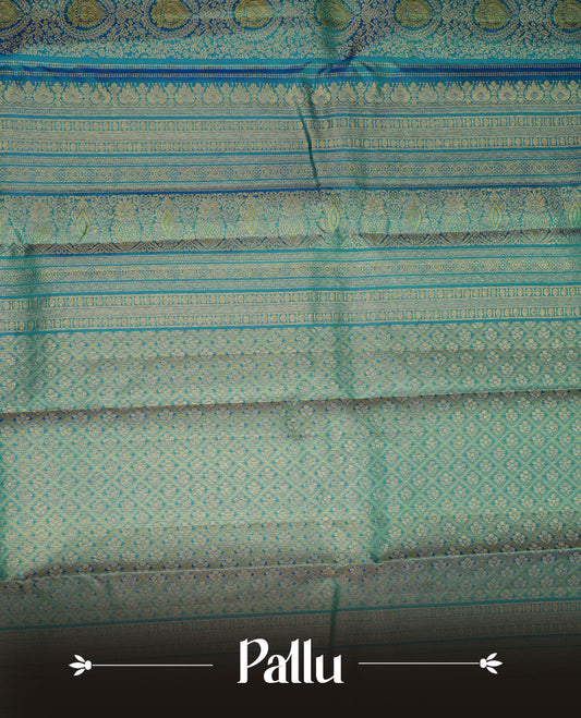 Peacock colour kancheepuram silk saree featuring gold zari pattern across body, complemented by selfcolour border traditional zari border, paired with matching blouse piece.