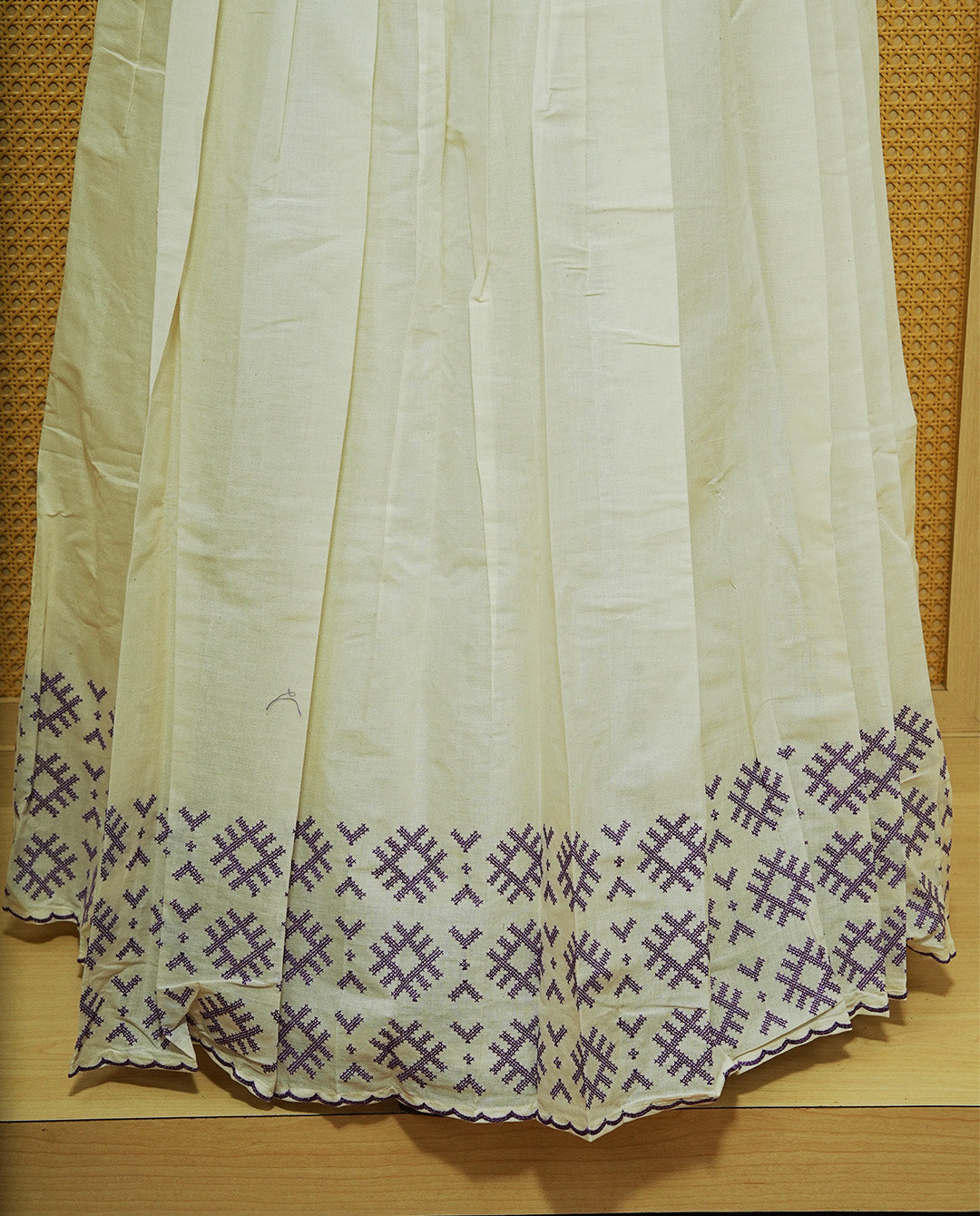 Cream colour cotton Stitched Skirt With Purple colour thread pattern Scallop border.