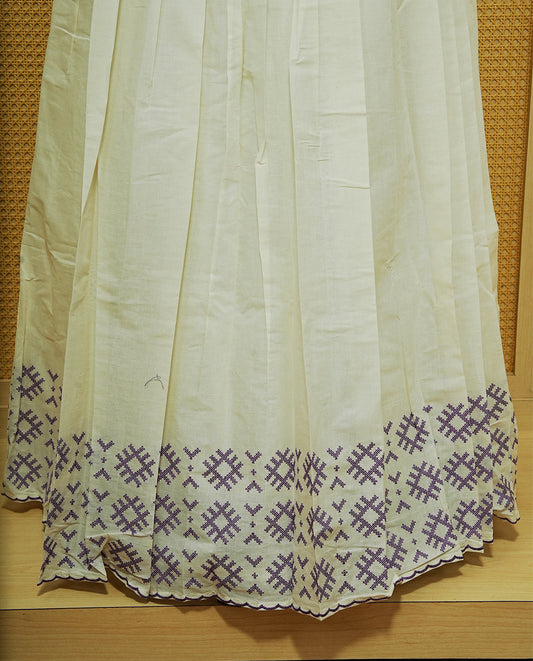 Cream colour cotton Stitched Skirt With Purple colour thread pattern Scallop border.