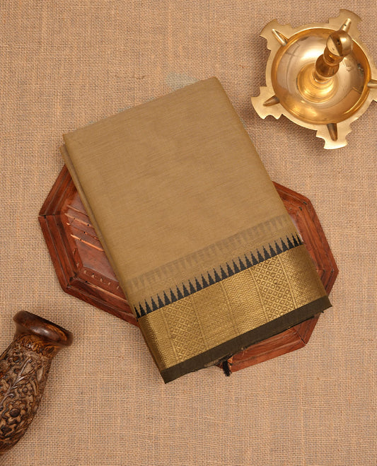 Sandal colour chettinad cotton saree featuring  Elegant plain body, contrast Black colour border with gold zari temple border, pallu and paired with matching blouse