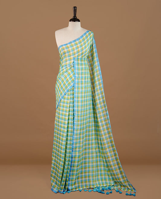 Blue, Green and White colour Mul Cotton saree featuring a classic Big check pattern on the body, accented with tassels for added charm. Comes without a blouse piece.