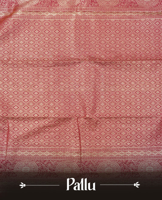 Deep wine colour semi wedding saree featuring light gold zari floral kodi pattern motifs across the body, complemented by contrast self colour traditional border. Comes with a matching blouse piece.