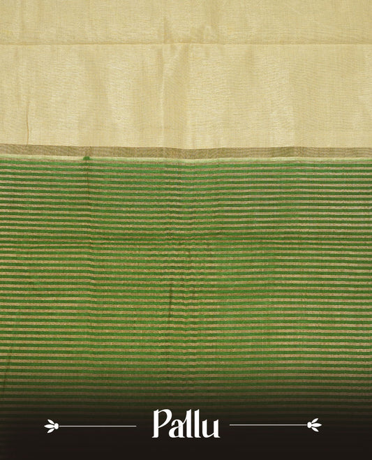 Cream colour tussar saree featuring elegant plain body, contrast Green colour gold zari border and comes with matching blouse piece.