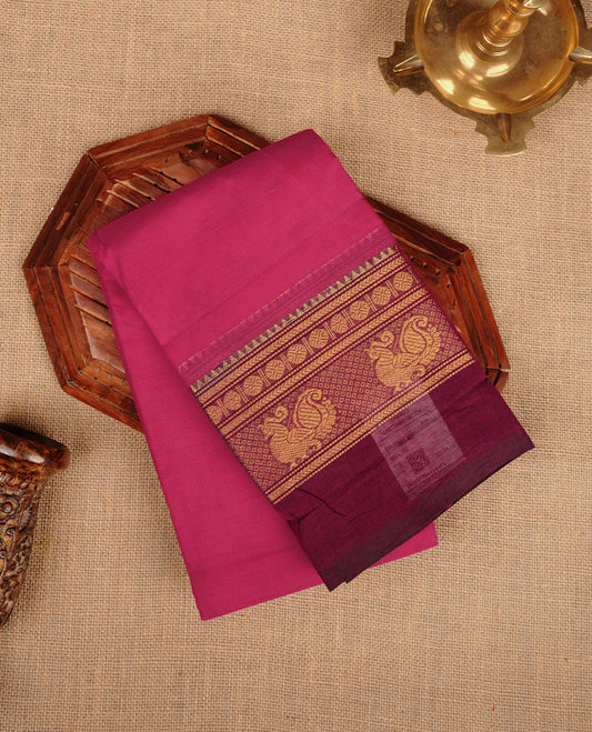 Rani Pink colour chettinad cotton saree featuring plain body, paired with a rich maroon traditional gold zari border without blouse.