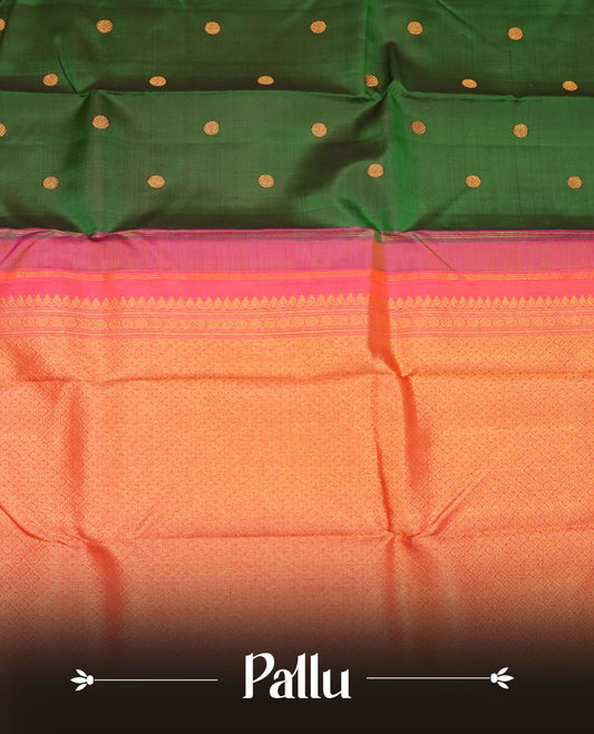 Bottle green colour pure traditional Kancheepuram silk saree adorned with gold zari motifs across the body, featuring elegant contrast orange traditional borders, beautifully paired with a matching blouse piece.