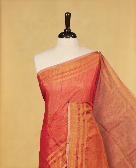 Red colour Semi Tissue Silk saree featuring Elegant plain body, Enhanced with Gold tissue Border & Striped Pallu & beautiful Tassels for Elegant Prefect Look.