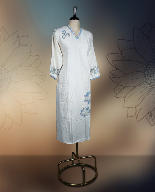 Off white colour kurthi with soft blue and pastel green floral embroidery on the neckline, sleeves, and hem & Featuring a classy V neck and three quarter sleeves, perfect for a refined and comfortable everyday look.