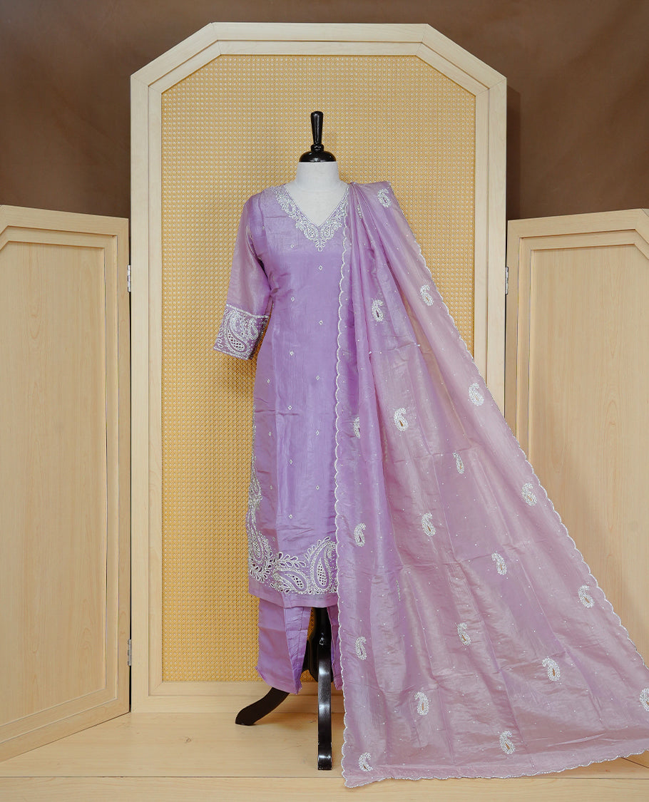 Lavender Colour churidar set with silver-tone thread, bead and sequin embroidery on the V-neckline and sleeve cuffs, subtle buti detailing, a matching embroidered paisley dupatta, and solid pants.