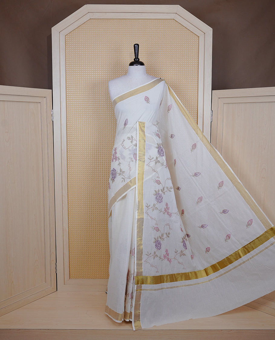 Cream colour Cotton Kerala saree featuring Floral Thread Embroidery work on body, complemented by gold kasavu Border, comes with matching blouse piece.