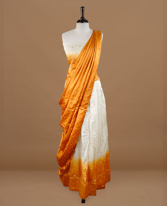 Off White colour half saree material featuring delicate zari buttas on the blouse and skirt, paired with a contrast Mustard zari border and matching zari motifs dupatta