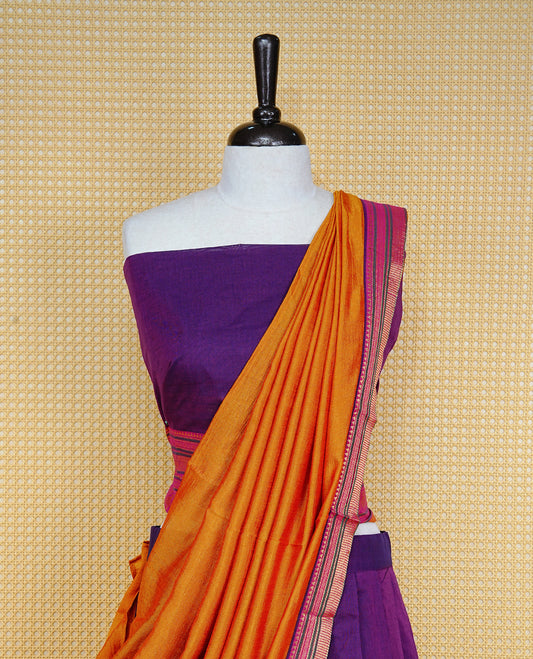 Purple colour Semi Stitched Dhavni set Featuring Purple Skirt With Contrast Mustard, Green & magenta colour with Zari border, paired with UnStitched Blouse & Elegant Dupatta.