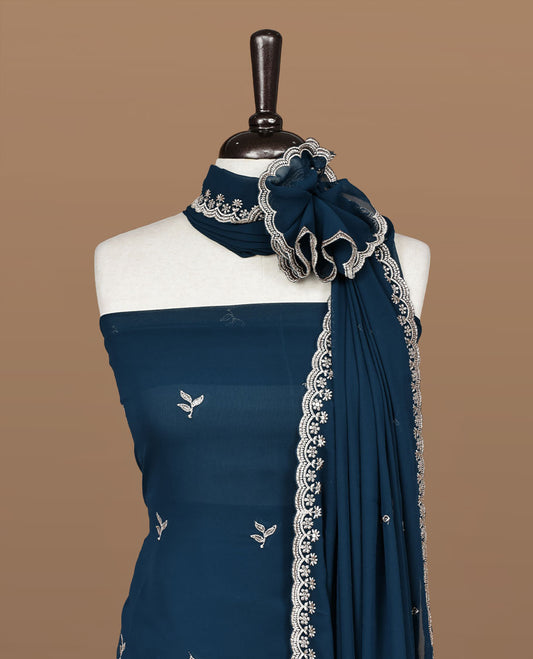 Teal colour churidhar material featuring gold thread floral pattern on body, paired with matching bottom & dupatta.