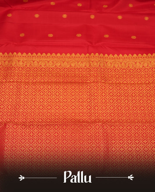 Red colour pure traditional Kancheepuram silk saree adorned with an elegant zari motif on the body