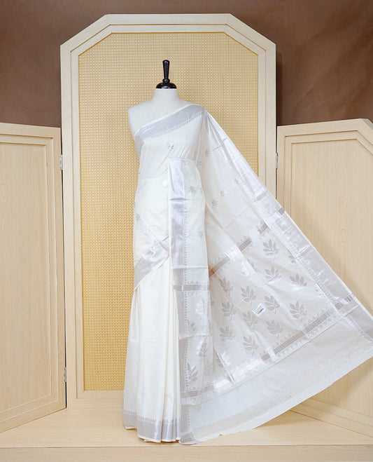 Cream Cotton Kerala Saree with Rose Gold Zari Leaf  Motifs, Rose Gold Zari Leaf Pattern Border and  Pallu, Paired with a Matching Blouse Piece.