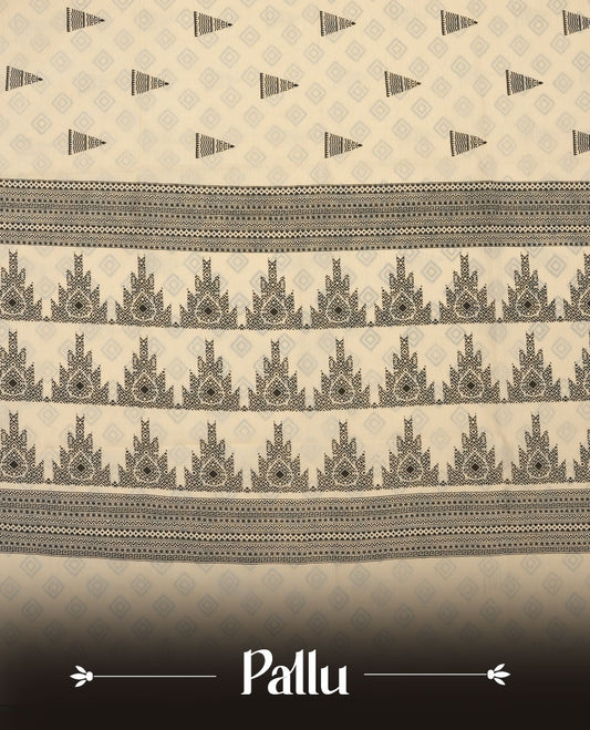 Cream colour poly cotton saree with black temple motifs on the body, paired with a matching with black woven traditional border, and a coordinated all‑over geometric printed blouse piece.