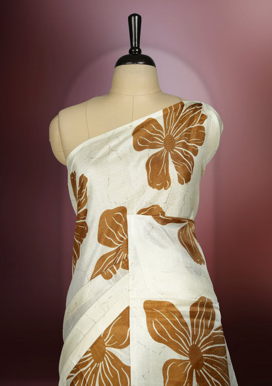 Mustard yellow and off white semi khadi silk colour saree featuring bold floral prints for a striking look, The lightweight, flowy fabric ensures effortless draping, perfectly paired with a matching blouse.