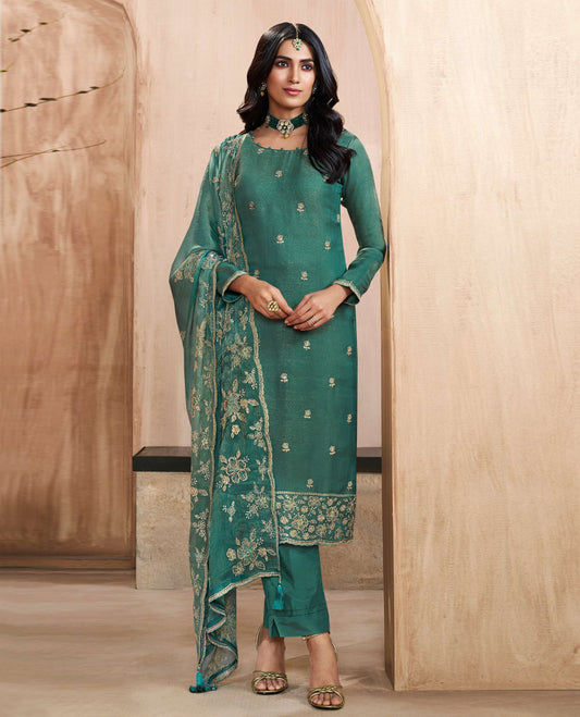 Pine green colour silk suit material with heavy kurta embroidery and stone work , paired with premium soft santoon bottoms and a silk dupatta detailed with rich floral kodi work