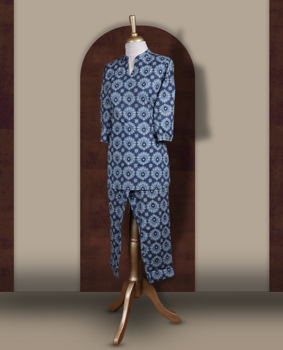 Blue colour cotton coord set with intricate all over prints, featuring a stylish mandarin collar and 3/4 sleeves, Paired with matching straight pants, it offers a perfect blend of comfort, elegance, and everyday sophistication.