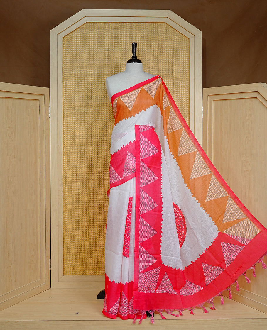 Cream colour semi linen saree featuring red Ajrakh pattern print on body, complemented by contrast Mustard colour with same pattern print Red border, comes with matching blouse piece.