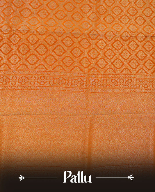 Orange colour banaras satin crepe saree featuring gold zari pattern across body, with self colour border with gold zari pattern and paired with matching blouse.