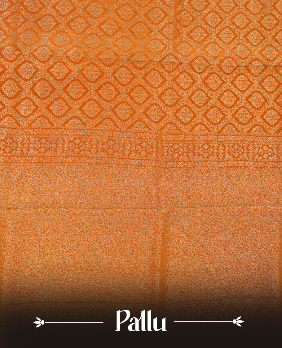 Orange colour banaras satin crepe saree featuring gold zari pattern across body, with self colour border with gold zari pattern and paired with matching blouse.