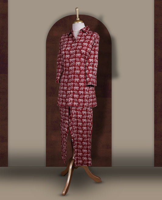 Maroon colour cotton coord set featuring charming elephant prints all over, Designed with a classic shirt collar and 3/4 sleeves, paired with matching straight pants for a trendy, relaxed, and comfy everyday look.