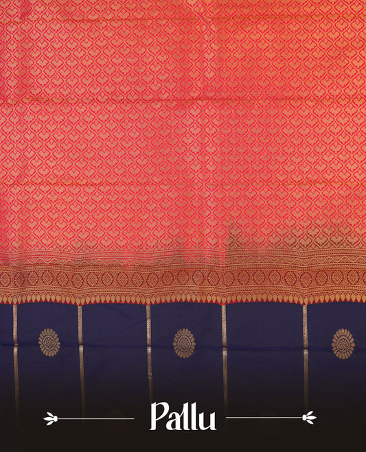 Navy blue colour semi silk saree highlighting gold zari strip pattern with motifs across body, featuring contrast rani pink colour border with gold zari pattern, comes with matching blouse .