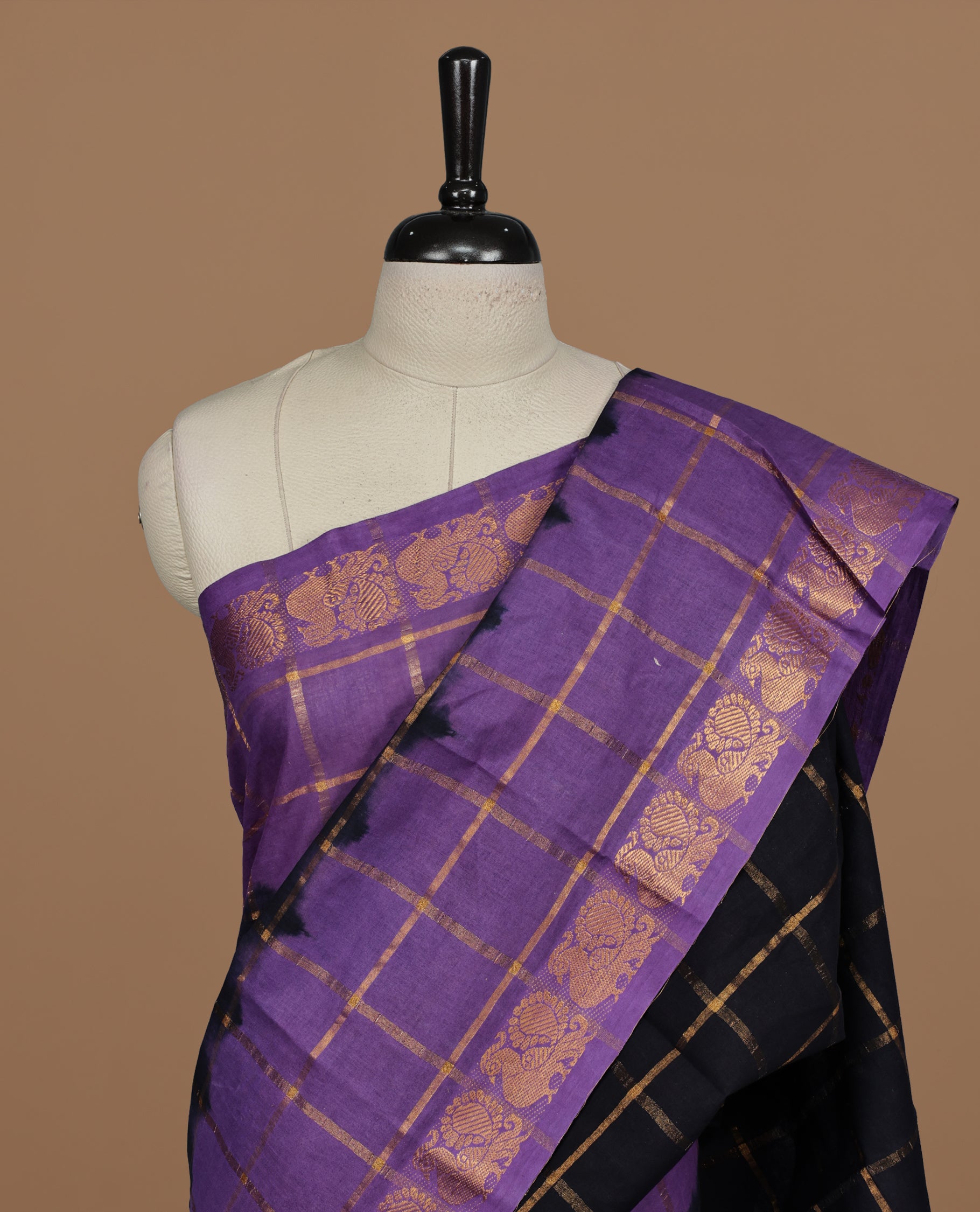 Black colour Sungudi cotton saree featuring Gold zari Check pattern on body, Gold zari Peacock design on Dyed Violet colour design border, paired with matching blouse piece.