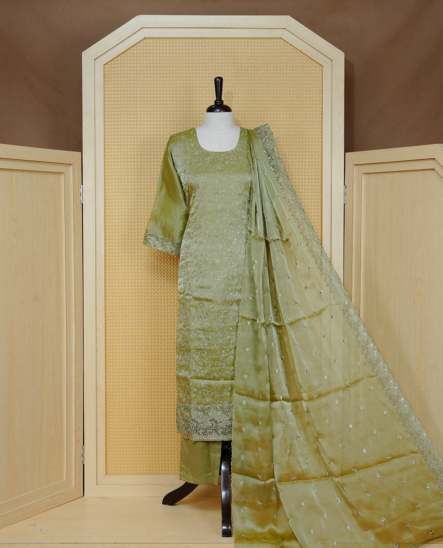Olive green Colour churidar set with floral thread embroidery On body & U shaped Neckline, paired with a matching lace-bordered dupatta and solid pants.