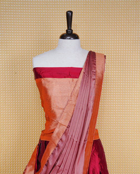 Maroon colour Half saree featuring Plain skirt with Zari border on contrast Bronze colour border, Unstitched Blouse and matching dupatta.