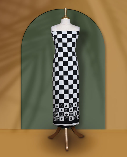 Black & white churidar set featuring a crepe top with chessboard and character prints, paired with a plain santoon bottom and a georgette dupatta adorned with chess coin prints.