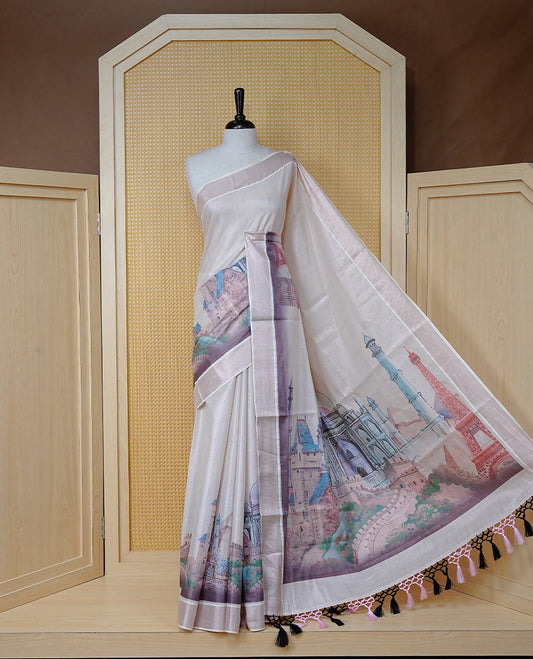 Cream colour Cotton Kerala Saree featuring a clean plain body with painted style digital prints of Seven Wonders, rose gold border, Finished with pink and black tassels, and paired with a matching blouse piece.