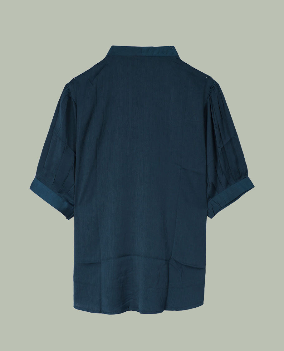 Teal blue V-neck shirt top with single decorative front button, elbow-length cuffed sleeves, and soft gathers at the shoulders.