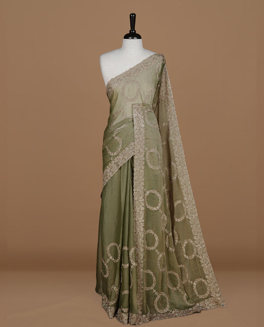 Olive colour organza saree featuring thread & gold stone pattern on body, highlighting scalp border, paired with Matching blouse piece.