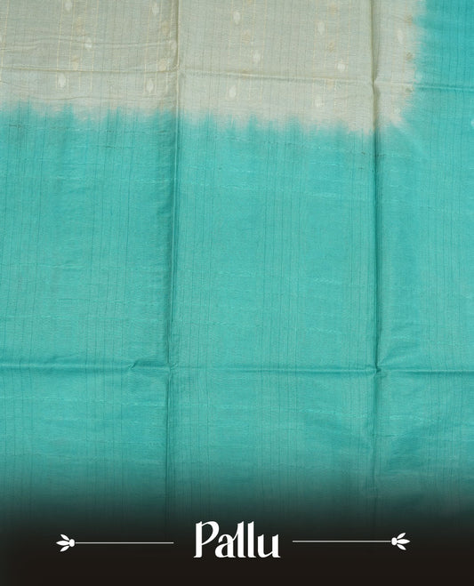 Cream & aqua dye pattern colour semi jute saree highlighting white stripped body, without border and paired with matching blouse.