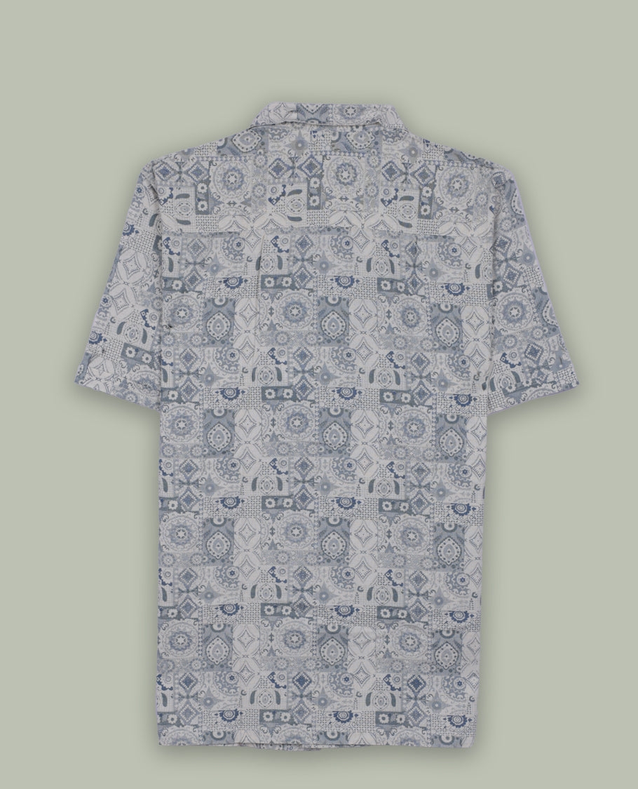 Cream colour short sleeve shirt features a rounded spread collar and a featuring an intricate blue and grey geometric tile design & its ideal for both casual days and laid back evenings.
