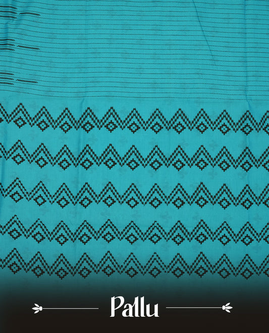 Teal blue colour poly cotton saree with black vertical dotted line pattern on the body, paired with a matching pallu featuring black zigzag geometric border, and a coordinated all‑over black stylised fleur‑de‑lis printed blouse piece.