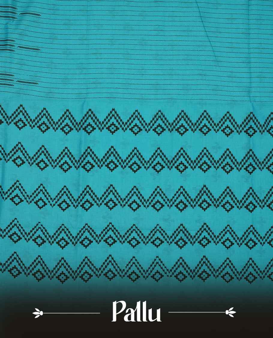 Teal blue colour poly cotton saree with black vertical dotted line pattern on the body, paired with a matching pallu featuring black zigzag geometric border, and a coordinated all‑over black stylised fleur‑de‑lis printed blouse piece.