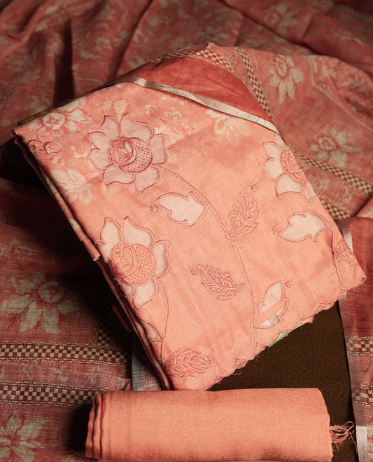 Peach colour churidhar material featuring cutwork and thread embroidery on the front panel, floral digital printed dupatta with elegant border, and matching plain bottom.