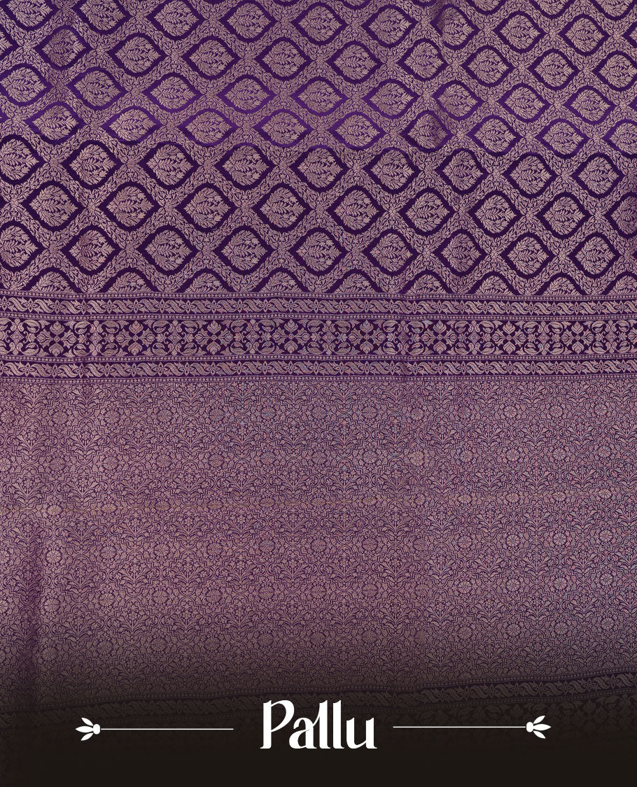 Deep purple colour banaras satin crepe saree featuring gold zari pattern across body, with self colour border with gold zari pattern and paired with matching blouse.