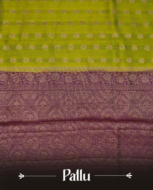 Olive colour Banaras tussar silk saree featuring elegant gold zari buttas across the body, complemented by a contrast Maroon border with rich zari detailing. Comes paired with a matching blouse piece.