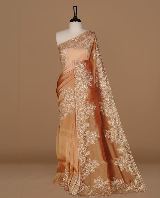 Orange & gold double shade organza saree featuring thread & cut beats, sequins leaf pattern on body, highlighting scalp border, paired with matching blouse piece.