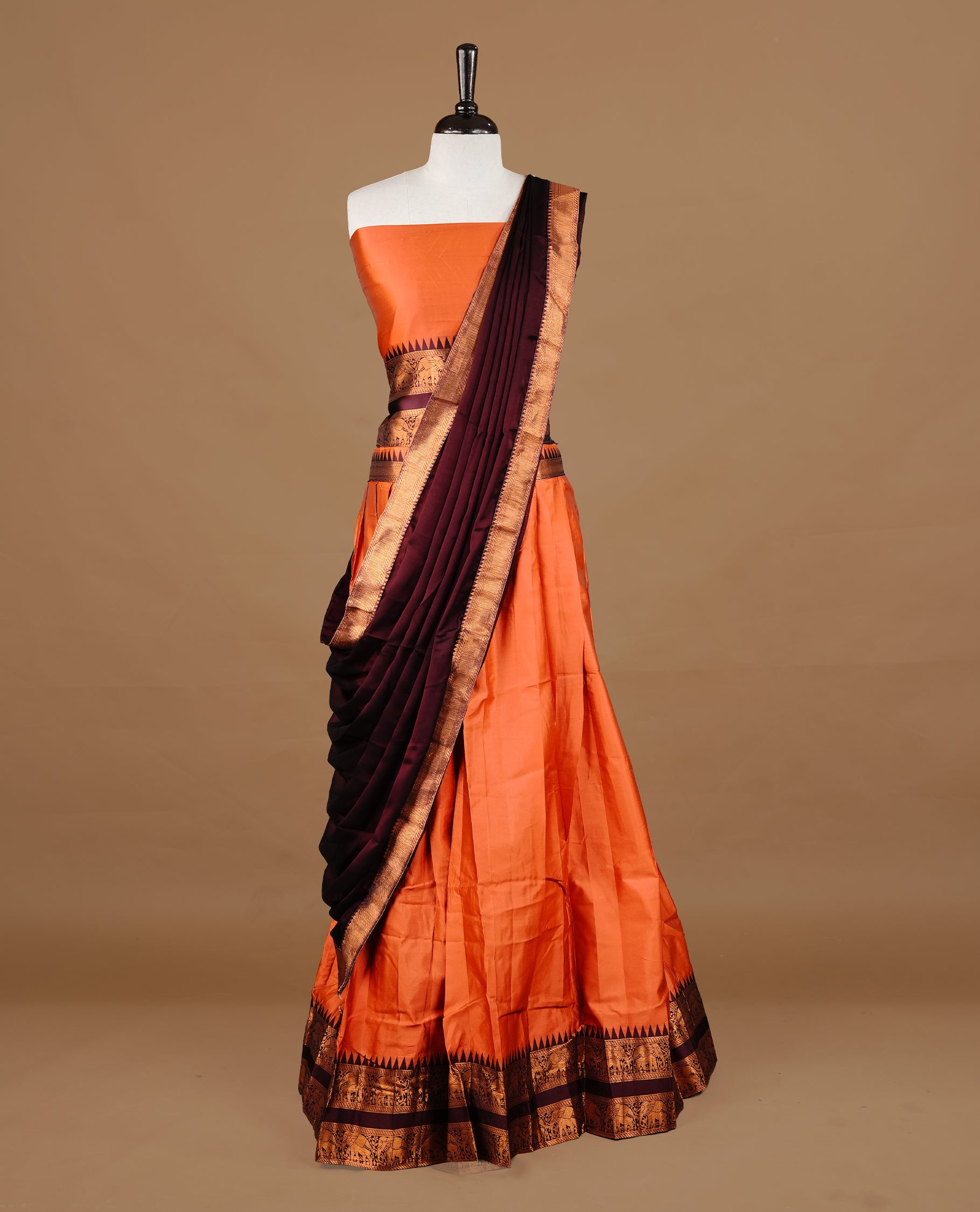 Rust orange colour semi stitched Half saree featuring contrast Maroon colour with gold zari traditional border skirt, paired with matching zari border dupatta, unstitched blouse piece