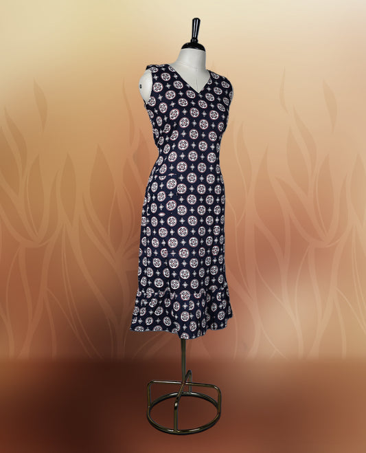 Black colour sleeveless nightwear with stylish white circular prints and a flattering V neckline, Tailored for comfort with a flared hem, perfect for casual outings, daily wear, or relaxed summer days.