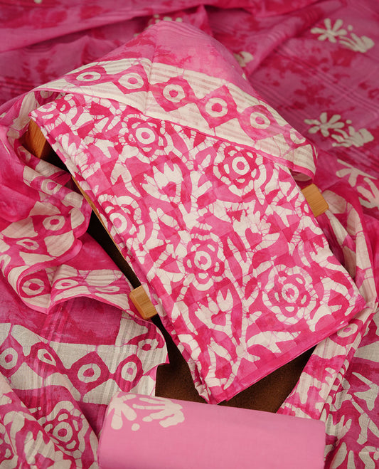 Pink colour churidar material featuring white floral printed body, paired with a matching chevron printed dupatta.